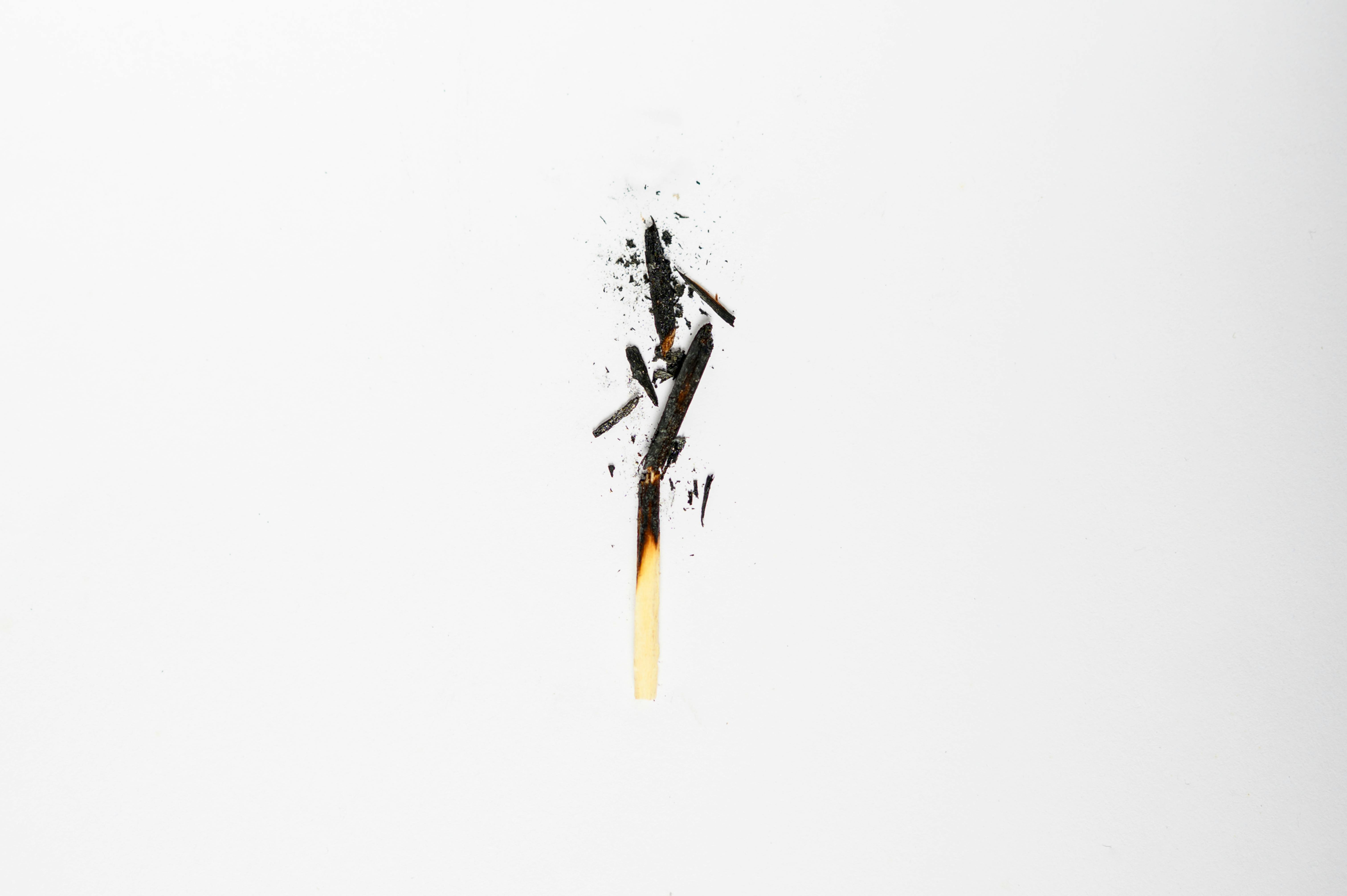 Burnt matchstick with white background